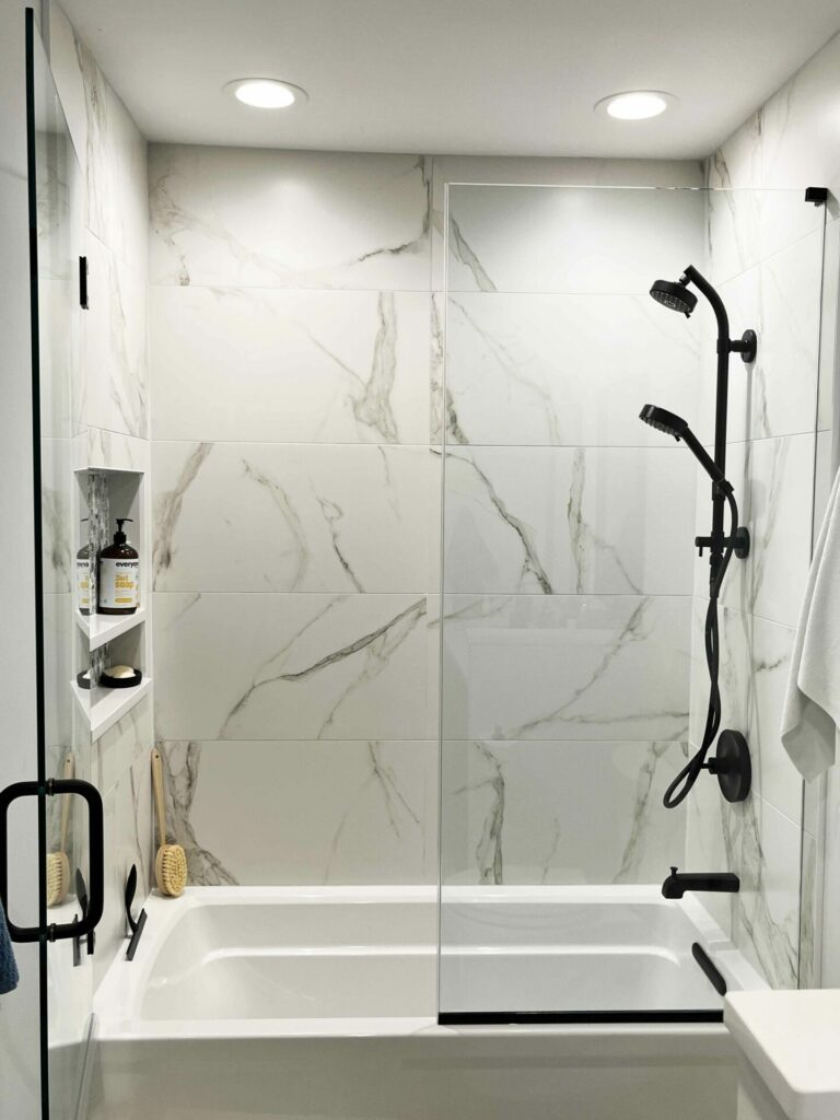 semi-frameless shower door with black handle