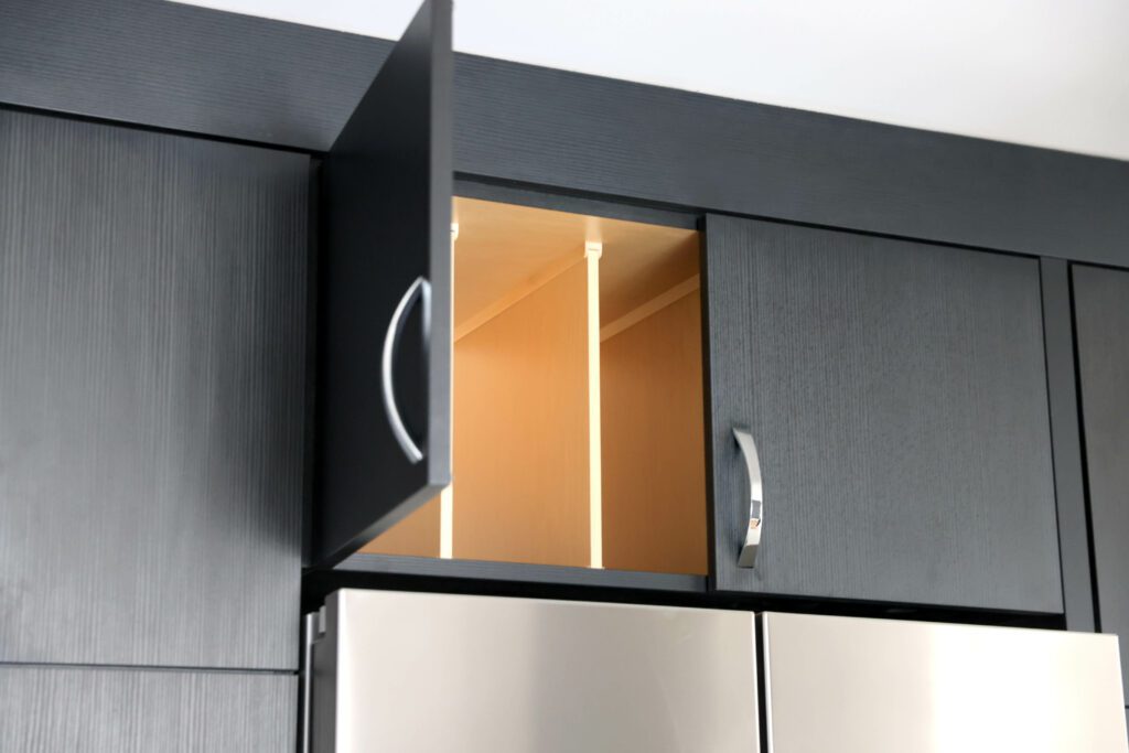 Kitchen cabinets above the fridge with tray dividers