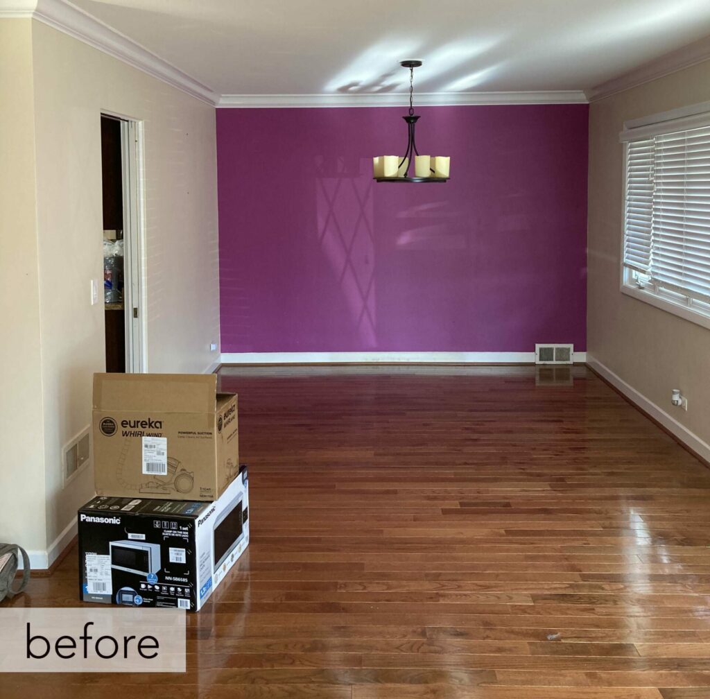 before kitchen with wall separating kitchen and dining room with purple accent wall