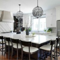 white kitchen with large island that seats six