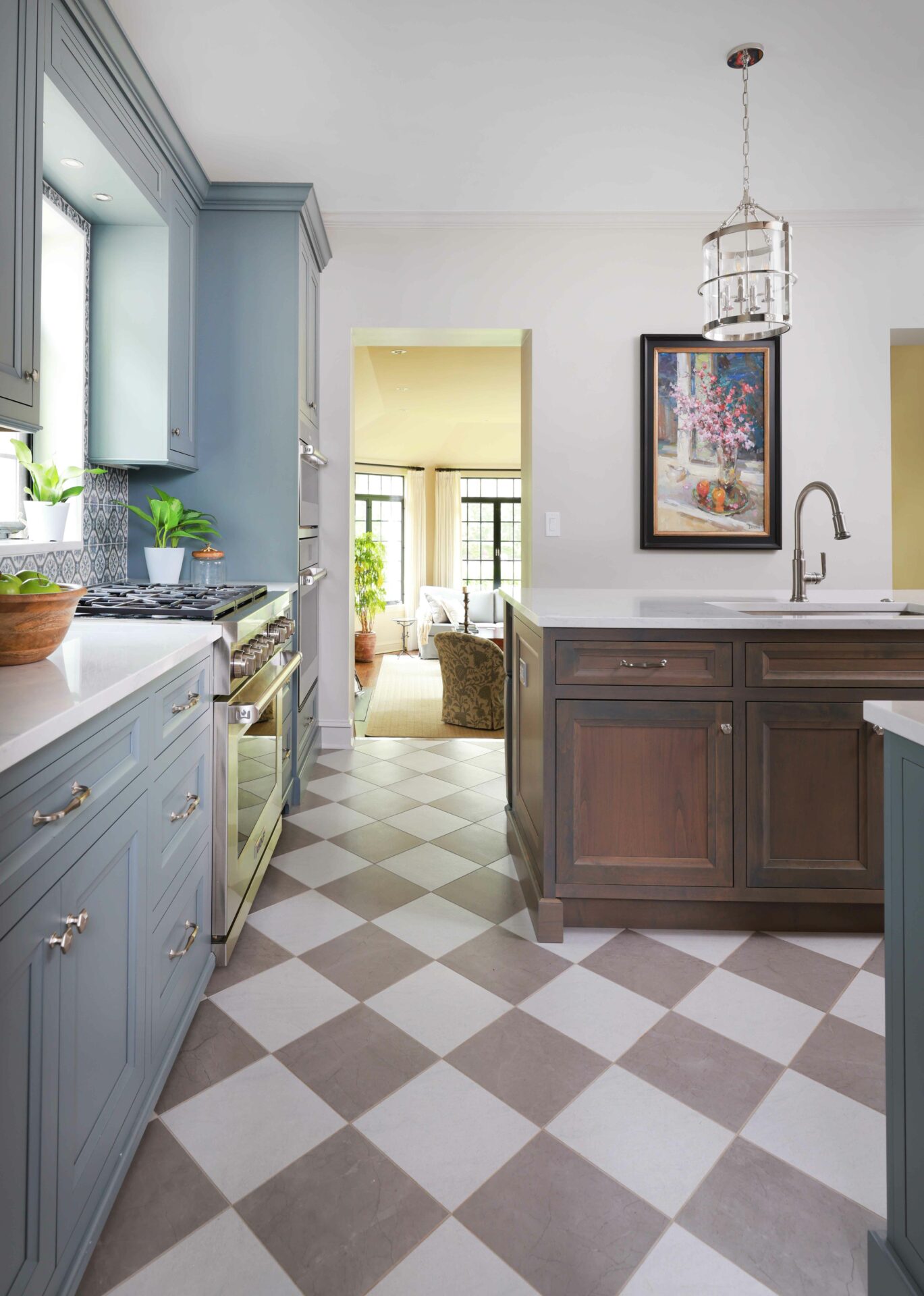 Gray painted cabinets and stained wood cabinets in a vintage inspired kitchen