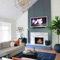 Fireplace accent wall with TV above