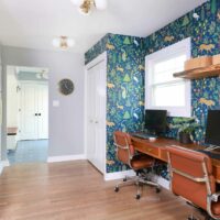 Two side by side home office spaces in a wide hallway