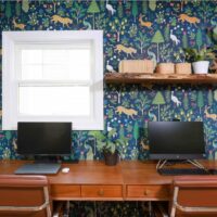 work from home office desk with wallpaper and floating shelf