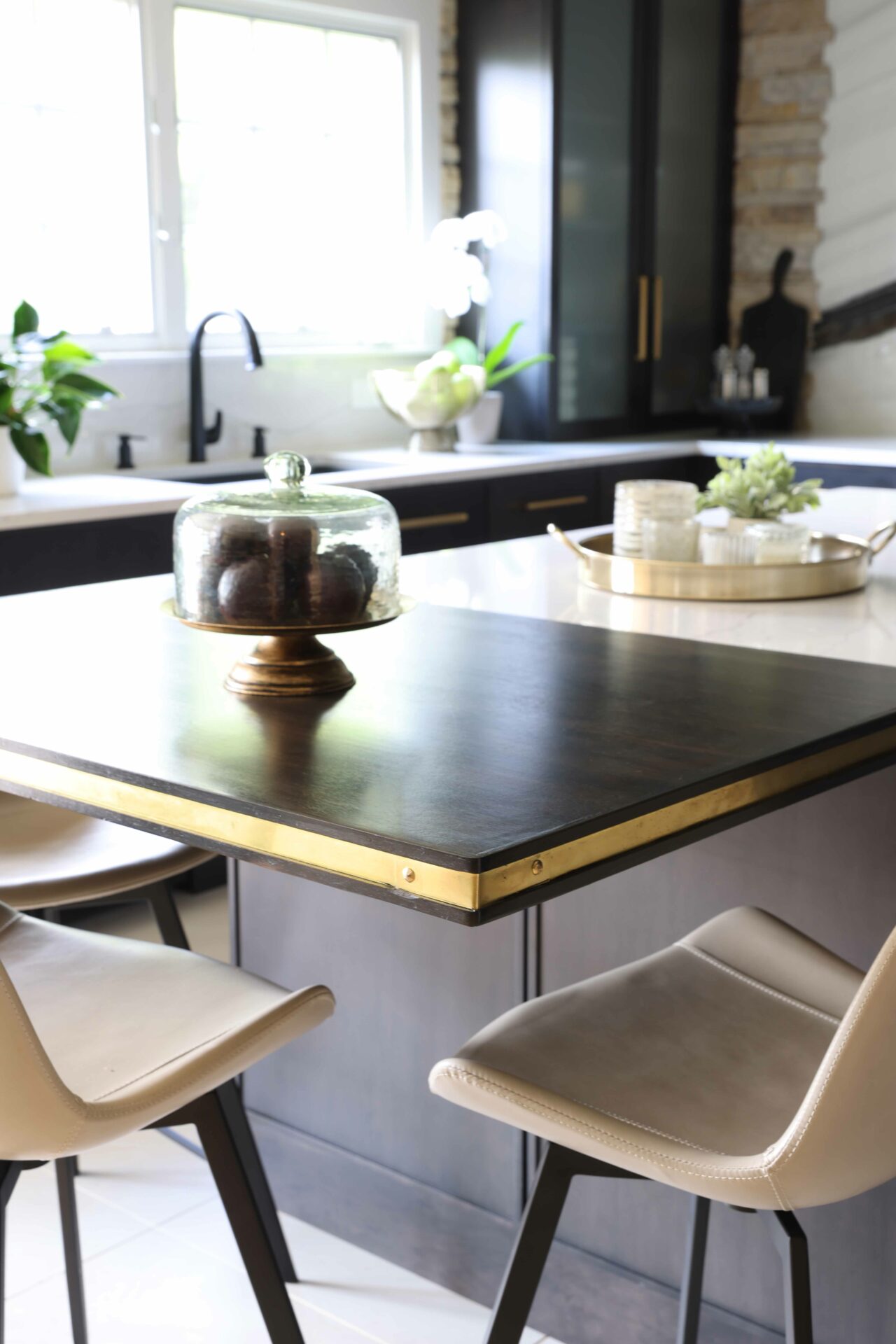 black kitchen countertop with gold trim