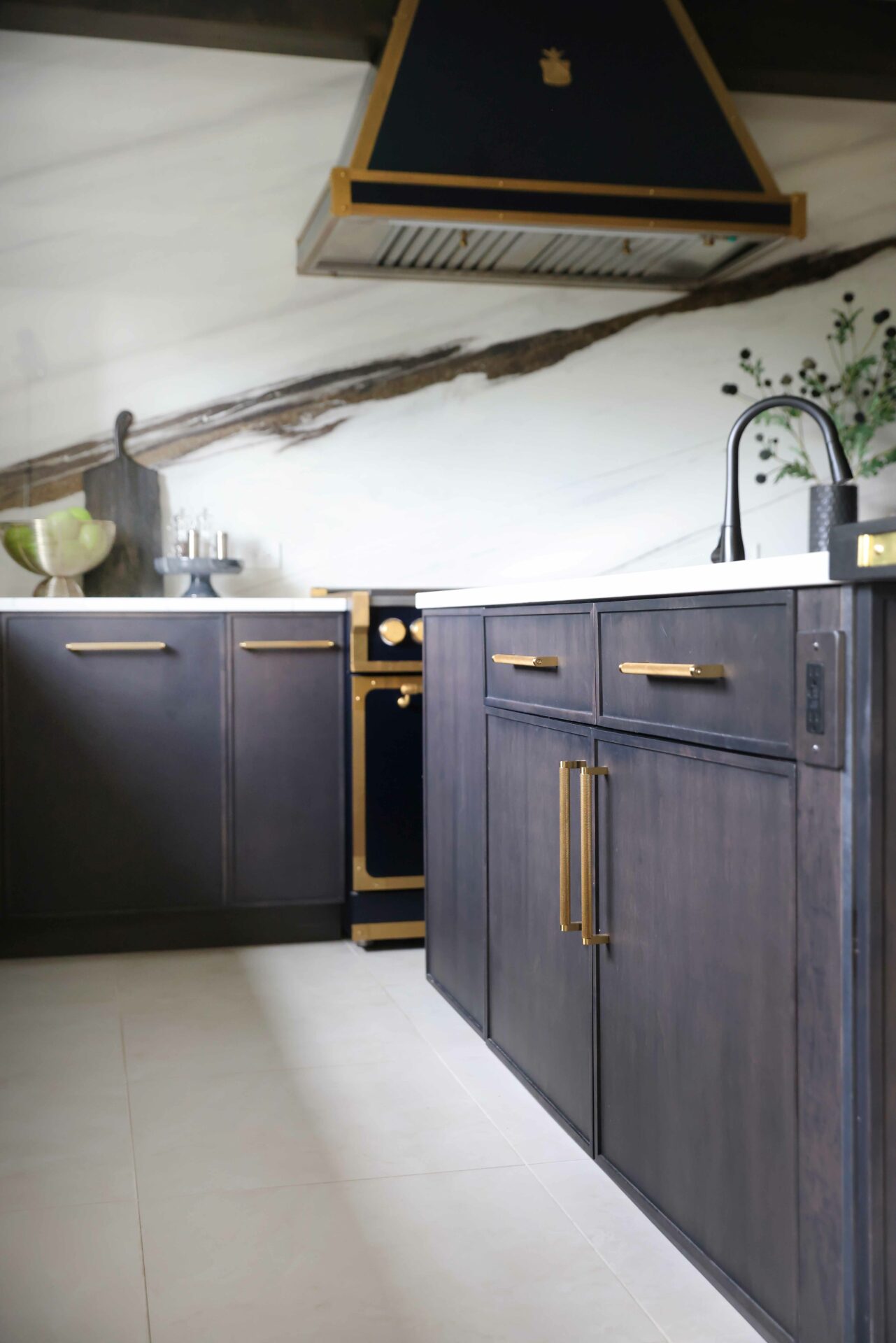 black stained kitchen cabinets with gold hardware