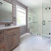Hall Bathroom with stand alone shower, hexagon floor tile, shiplap walls and hickory vanity