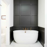Freestanding bathtub with dramatic accent wall