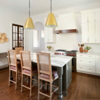 White kitchen with stained accents and dual pantries