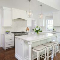 white kitchen addition with wood hood