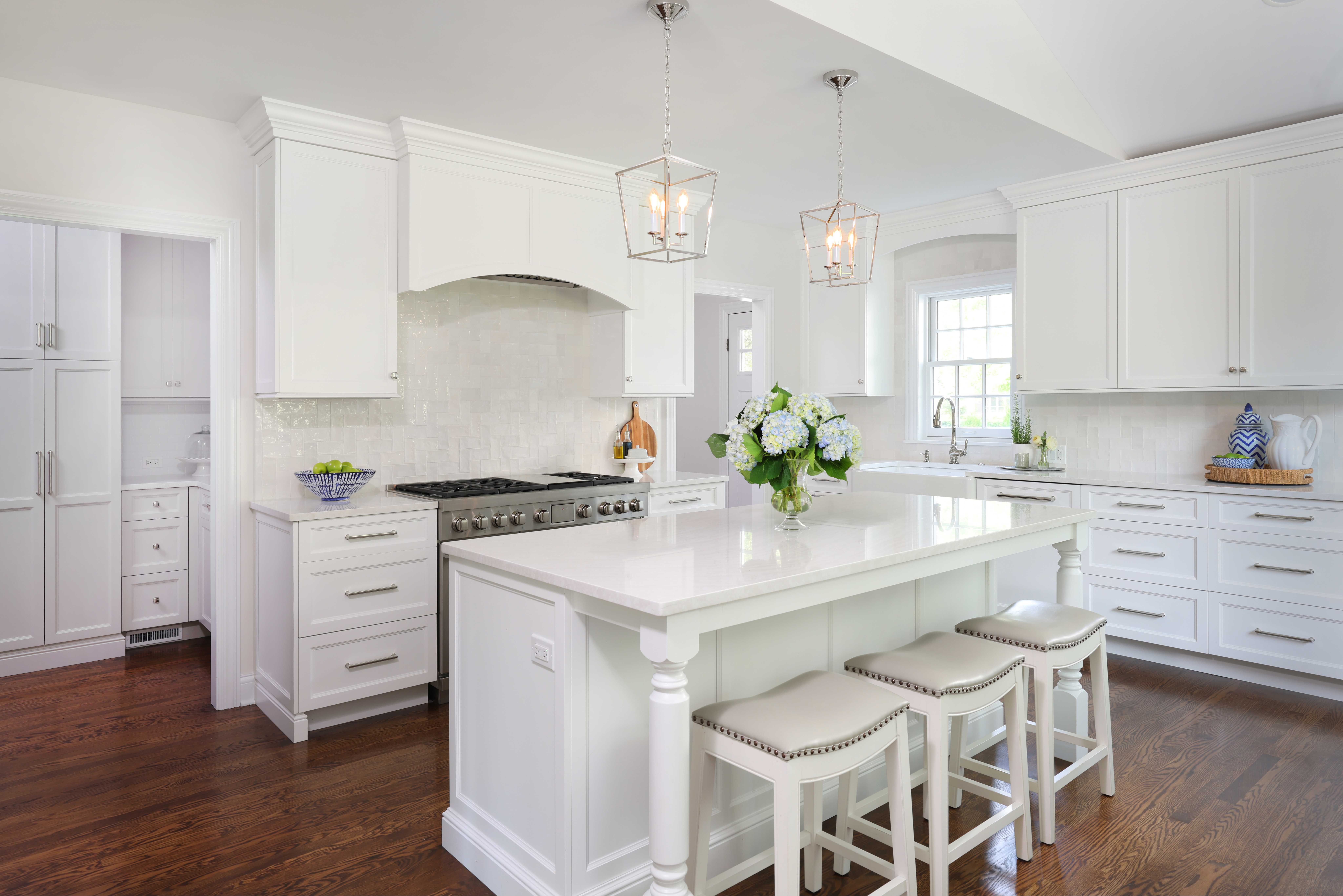 white kitchen addition with wood hood