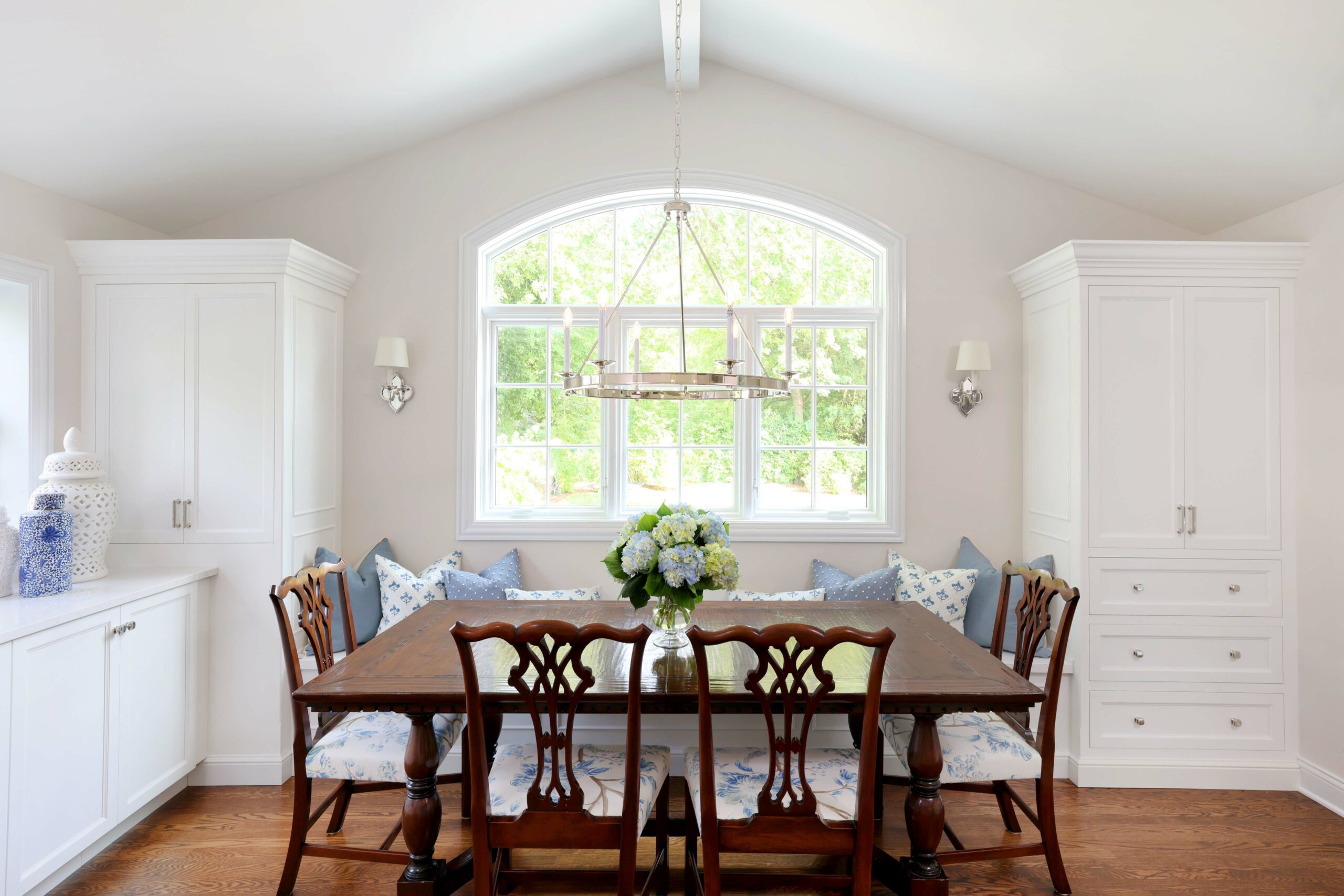 eat in area with window seat in white kitchen addition