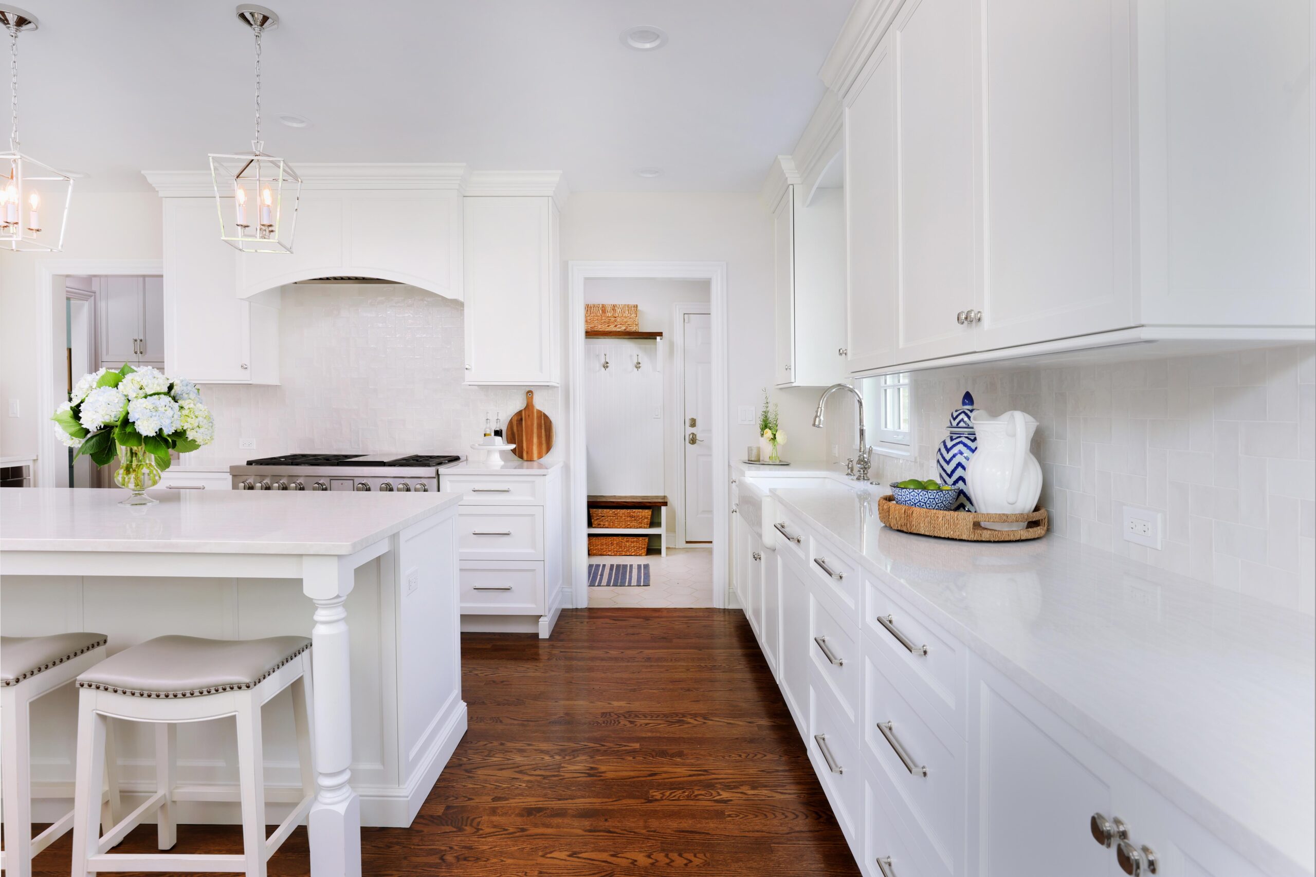 white kitchen addition with hardwood flooring