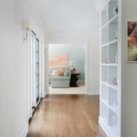 addition hallway with built in bookcase