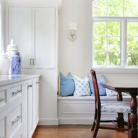 window seat in white kitchen addition