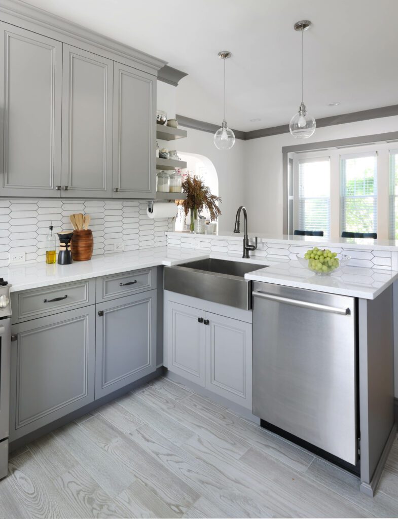 gray kitchen with stainless steel sink and dishwasher
