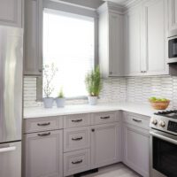 gray kitchen with ceramic geometric backsplash