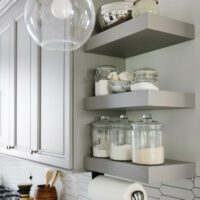 open shelving in gray kitchen with ceramic geometric backsplash