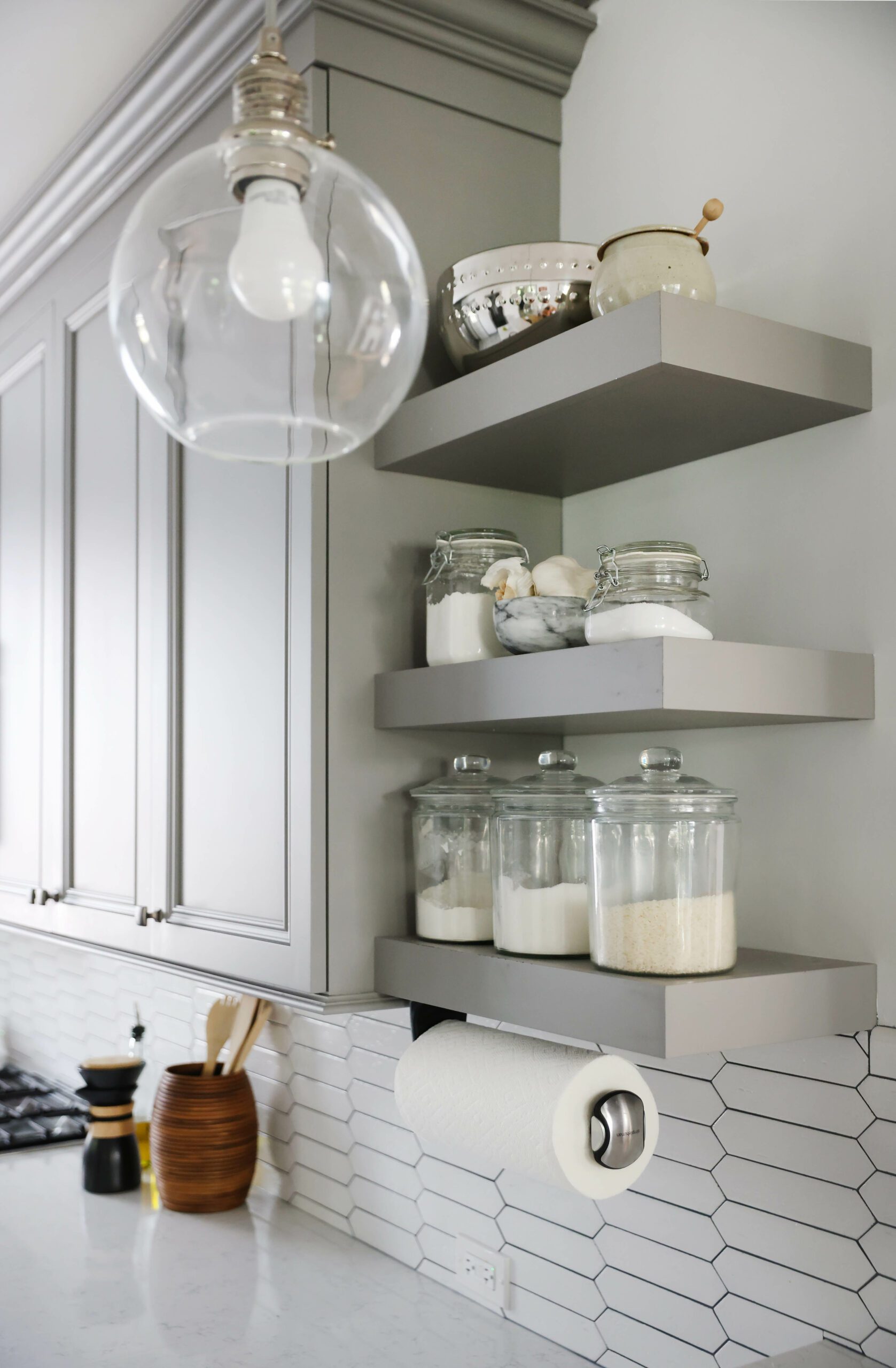 open shelving in gray kitchen with ceramic geometric backsplash