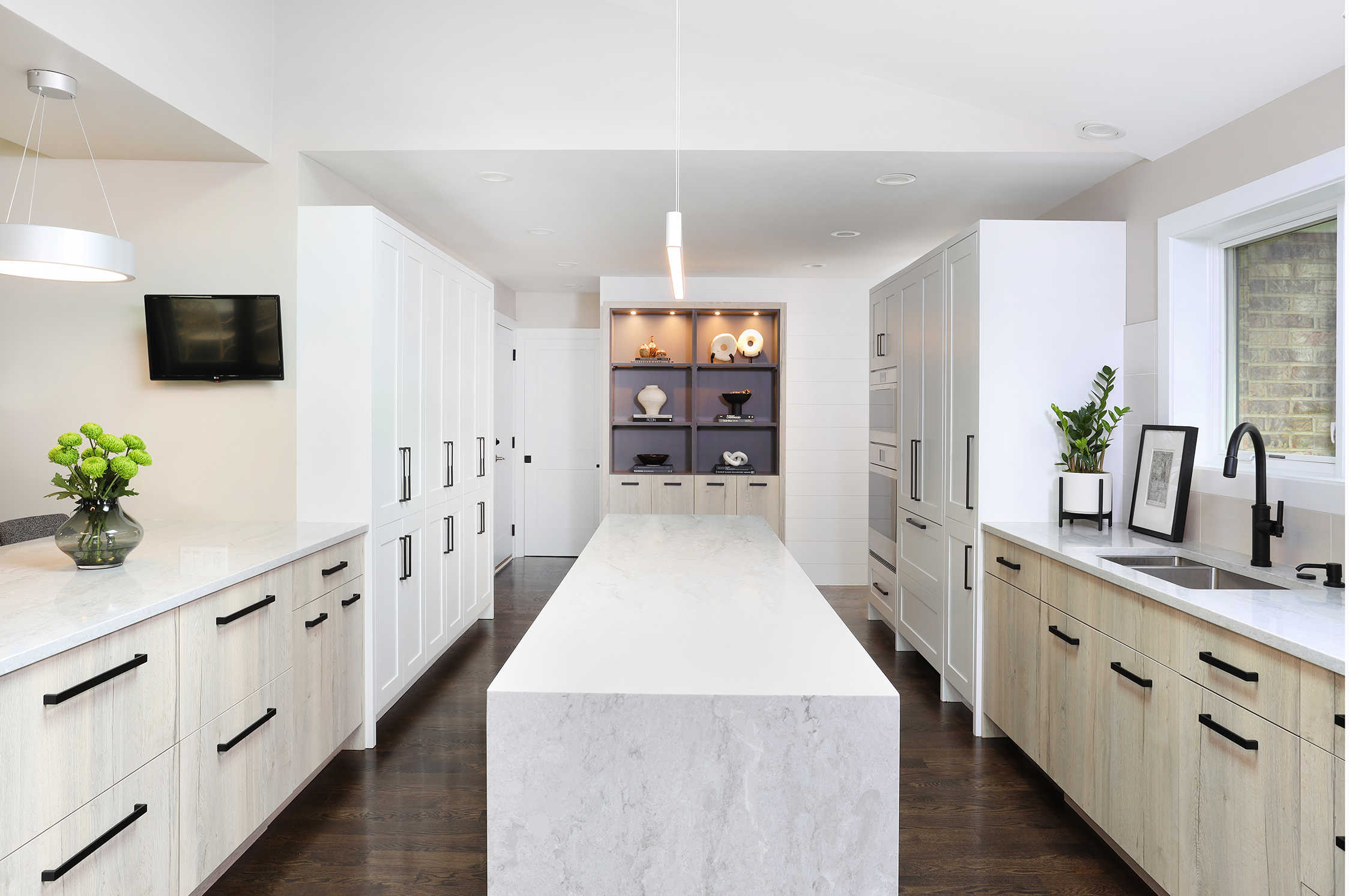 modern white kitchen with laminate cabinets and waterfall edge island
