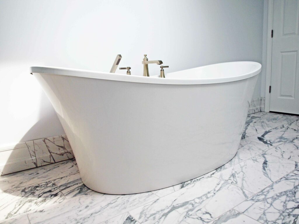 freestanding tub and matching tile baseboard