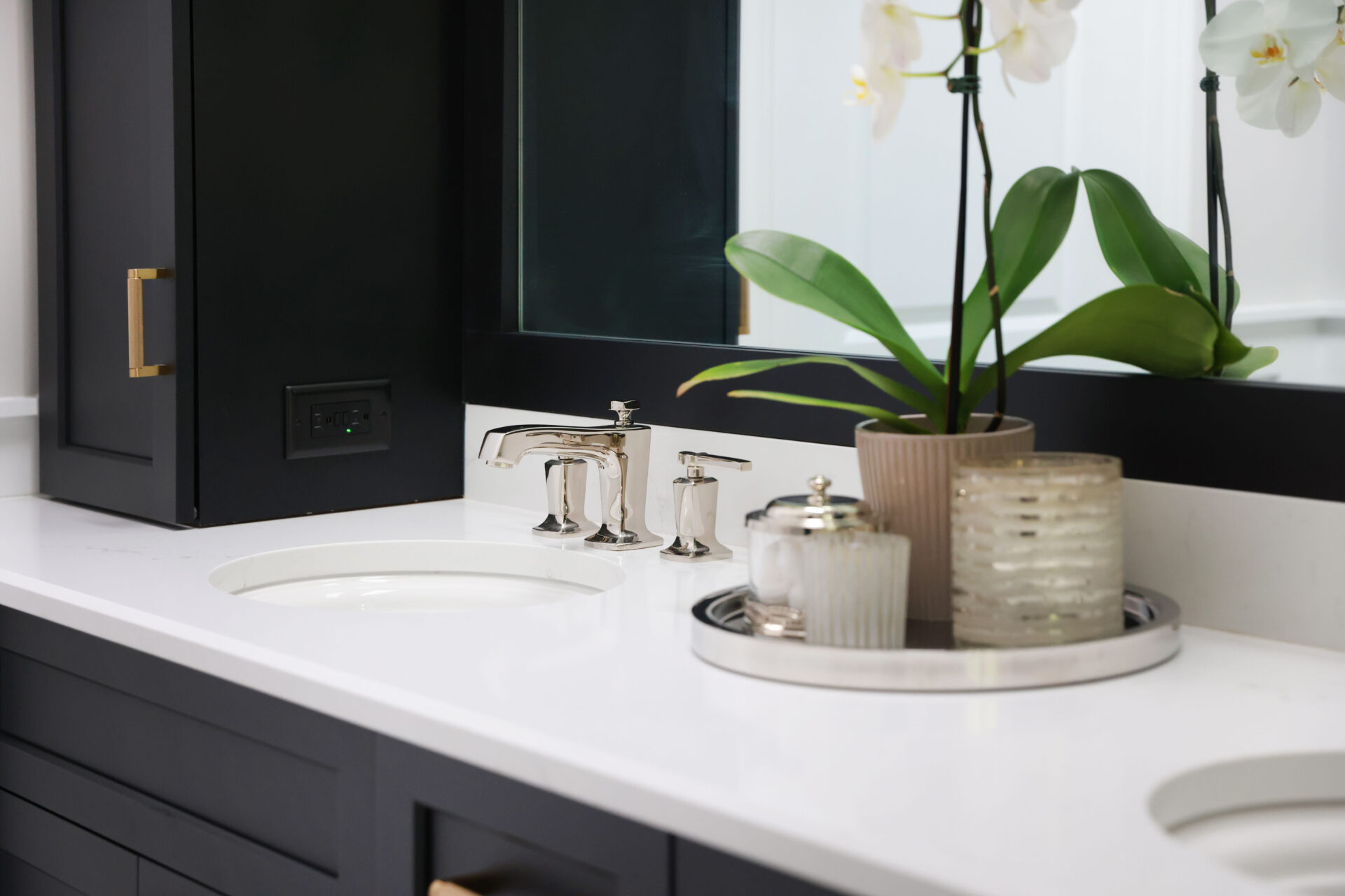 Black bathroom cabinets with white countertop